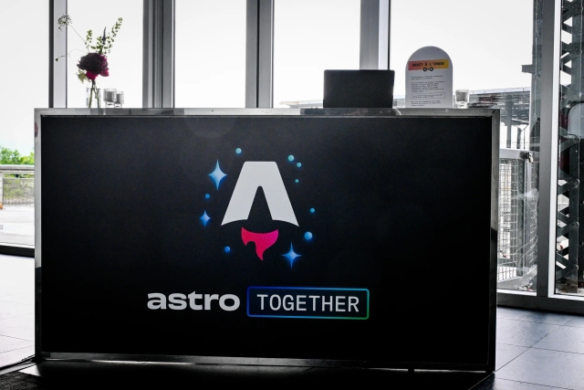 Black registration bar with the Astro Together logo across it in white, blue, and red.